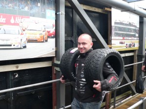 Silverstone racetrack - friendly man with tires on a bridge